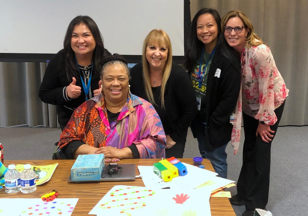 Dr. Nicki Newton posing with SCCOE CCLA team
