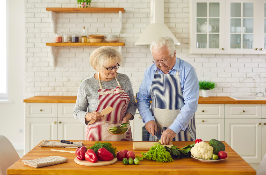 Older adults preparing a healthy meal together