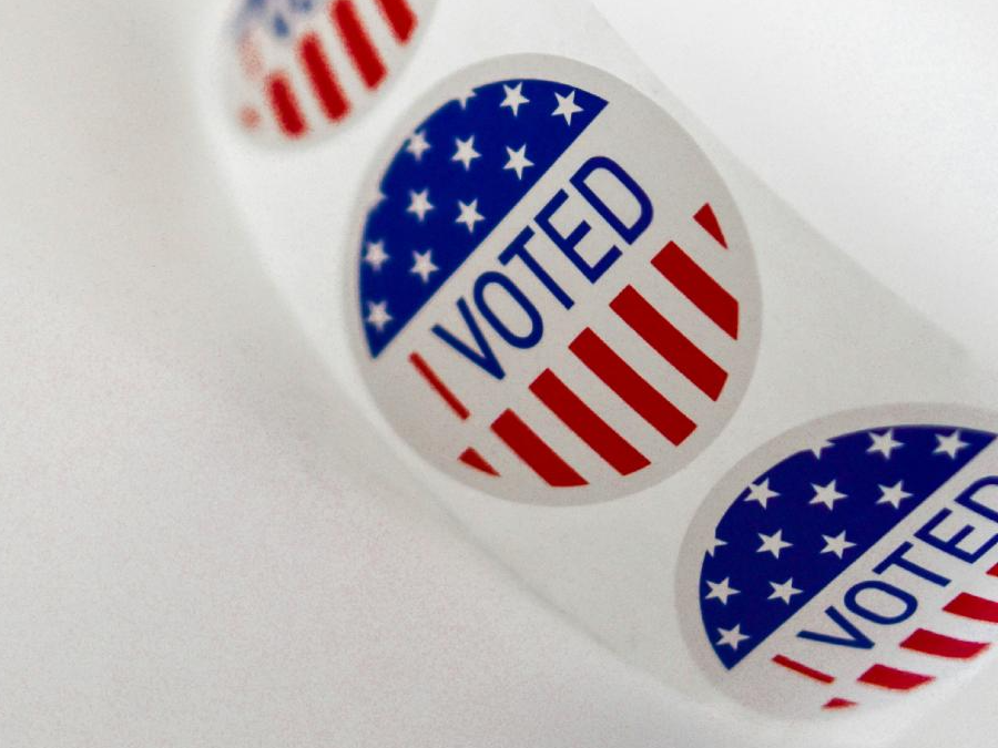 Circular stickers featuring bold lettering that reads "I Voted".