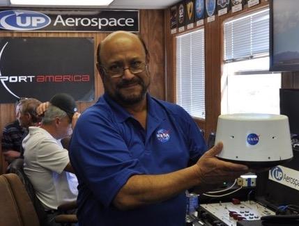 Paul De LeÃ³n holds NASA's Maraia Capsule technology payload, which launched on an UP Aerospace flight in Nov. 2015