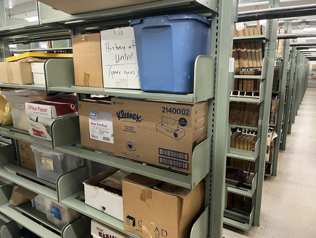 Photo of metal shelves containing boxes and totes