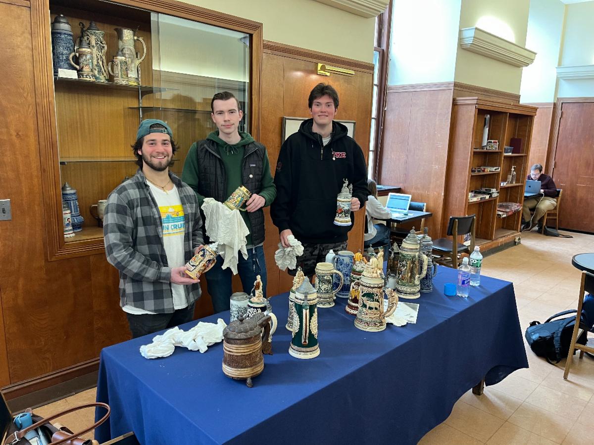 Photo of students involved in cleaning stein collection