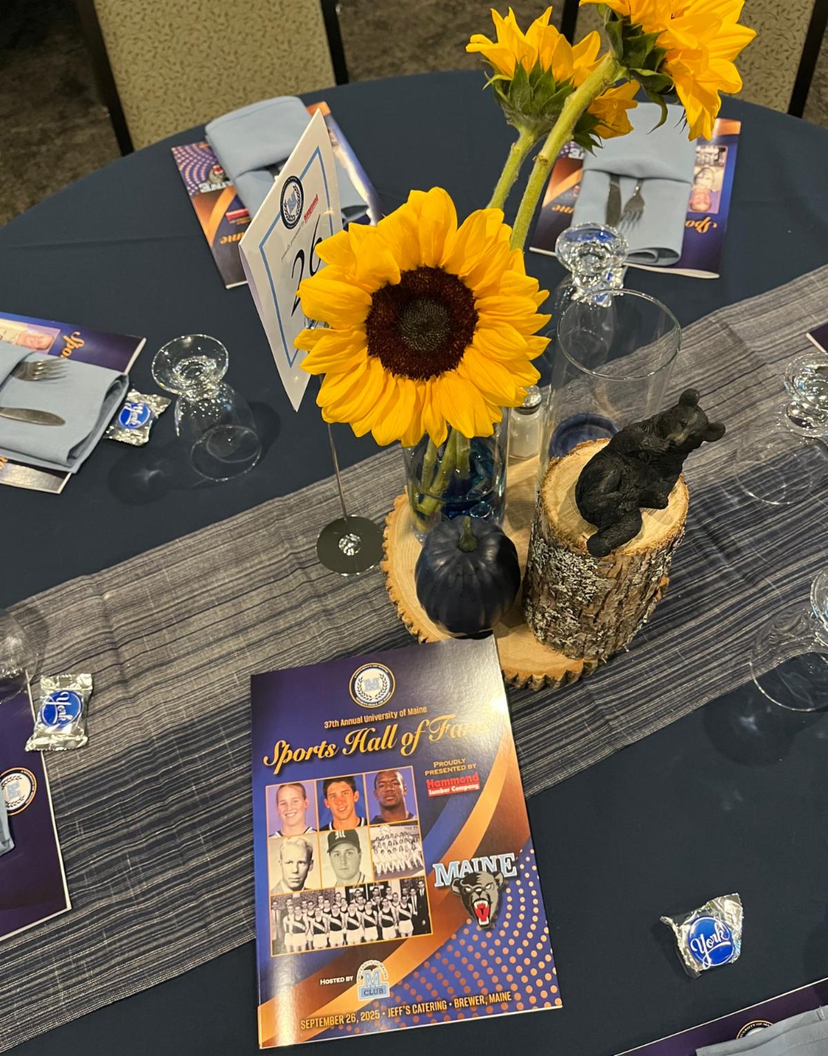 Photo of Maine Hall of fame booklet with sunflower and small black bear