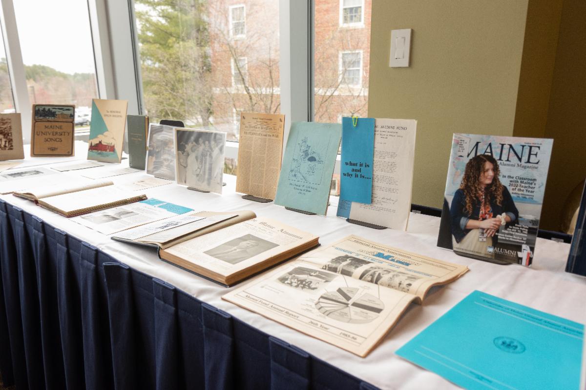 Books and other items on display at Alumni Association event