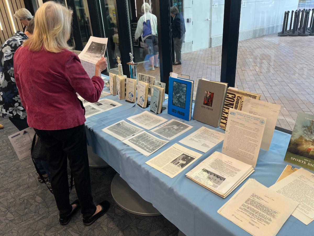 Photo of person looking at a display of memorabilia