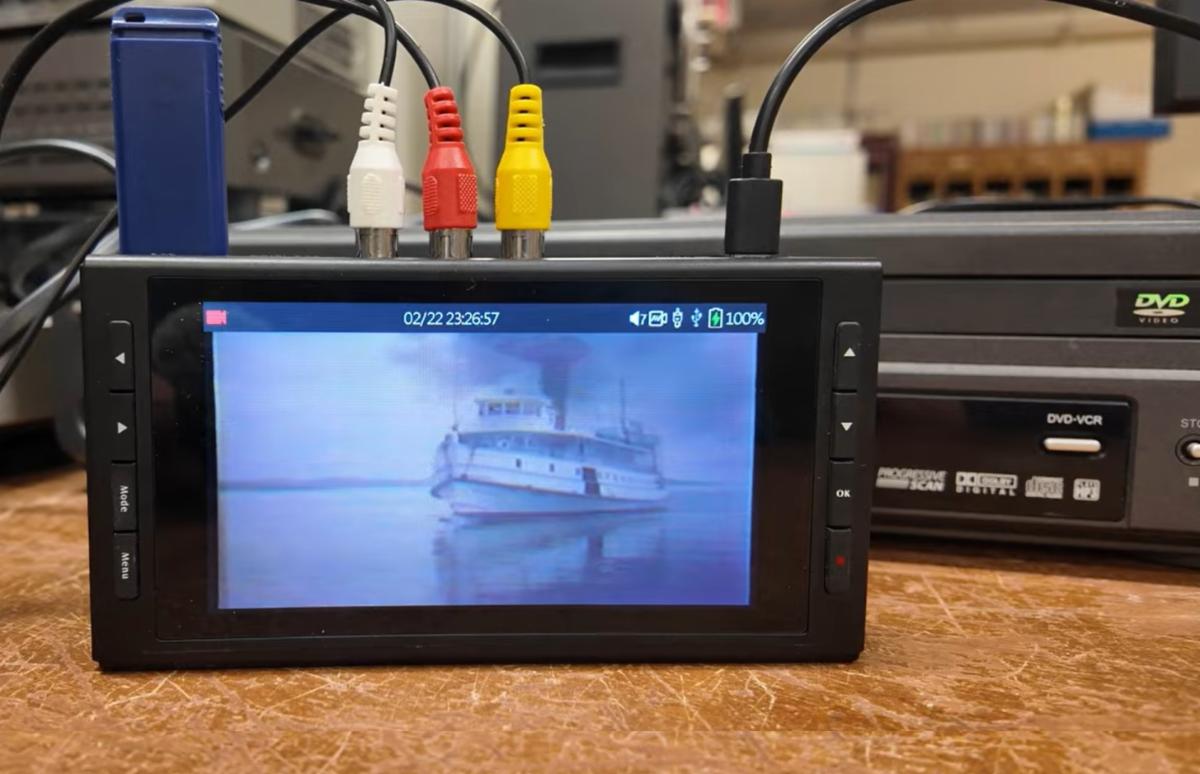 Photo of equipment and a video conversion in progress.
