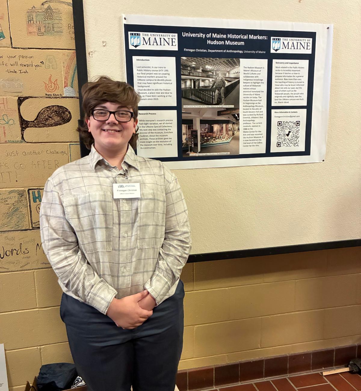 Photo of Finnegan Christian with the poster he presented