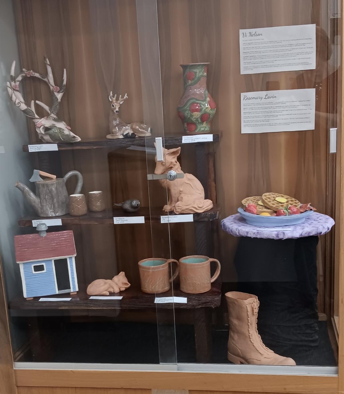 Photo of a display case featuring a variety of ceramic pieces