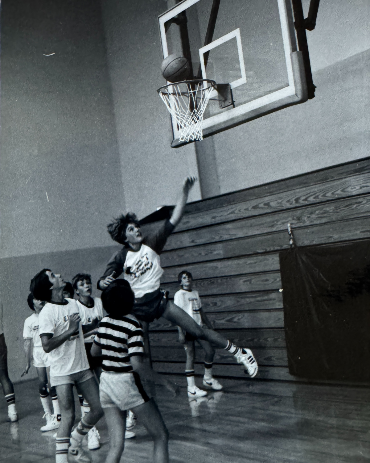 An image of students playing basketball at UMM in the 1970s or `1980s