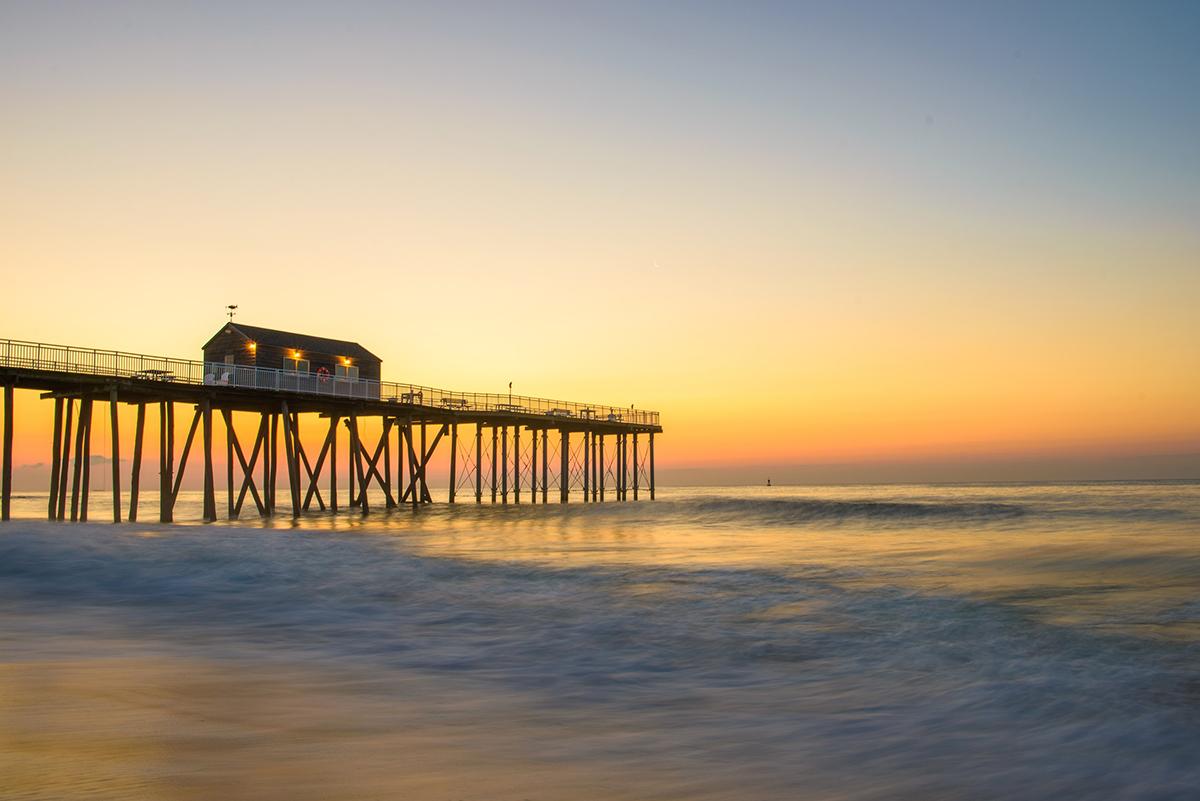An ocean pier at sundown