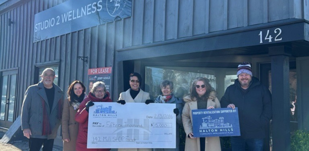  Councillor Norris, Economic Development and Innovation Manager Erin Kaiser, Mayor Ann Lawlor, Building Owner Claudia Lopez, Councillor Fogal, Councillor Garneau, DGBIA Manager Drew Pullman outside Studio 2 Wellness