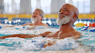Older adult men in aqua fitness class