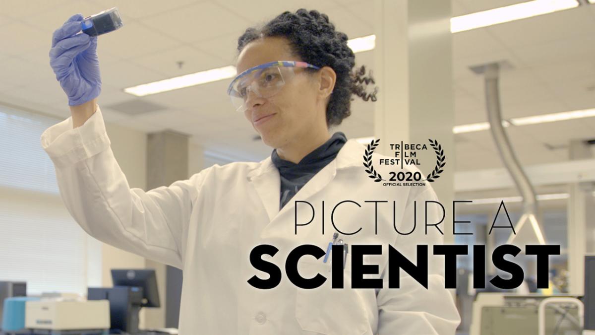 Women scientist holding up a sample vial