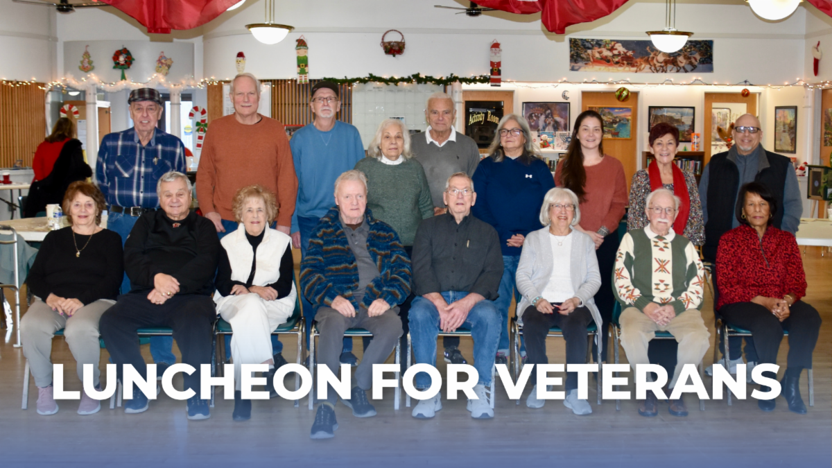 Veterans pose together at the luncheon event, with the words “Luncheon for Veterans” displayed on the image.
