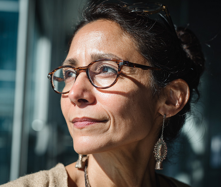 a woman at work wearing glasses