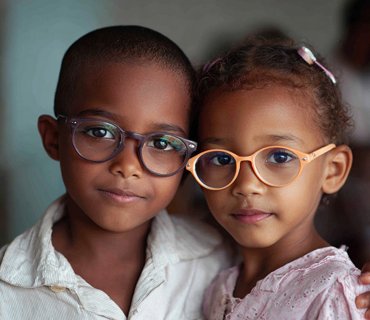 a school-aged boy and girl wearing glasses