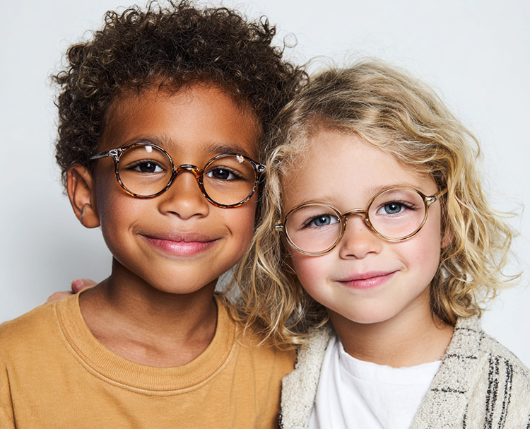 Two children wearing glasses