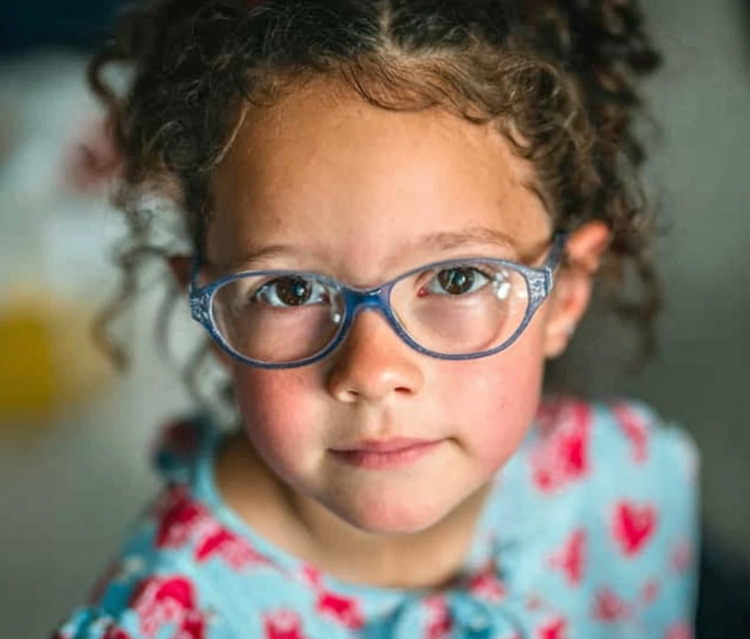 a preschool child wearing glasses