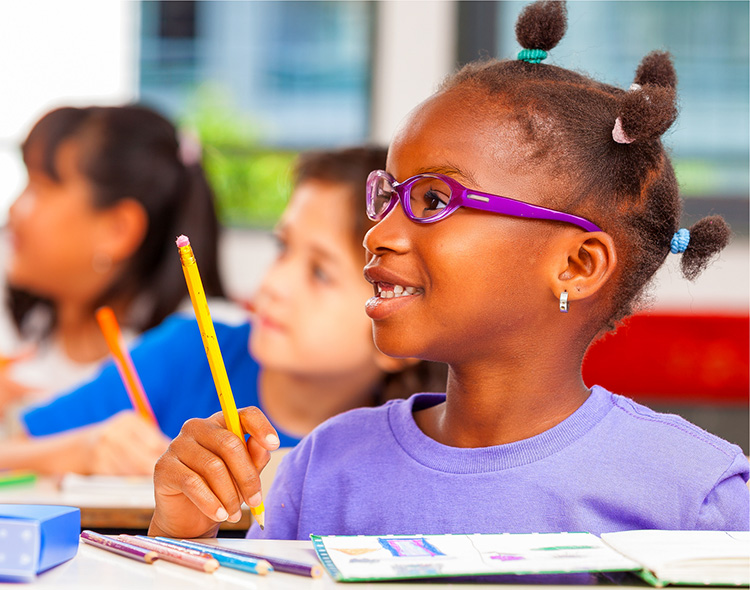 a child in school wearing glasses
