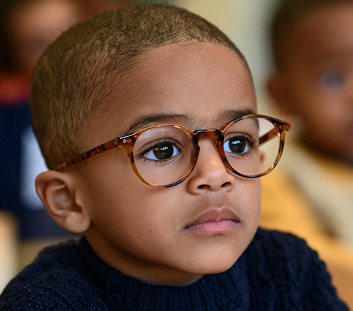 a young child wearing glasses