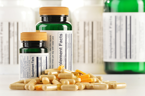 Composition with dietary supplement capsules. Drug pills