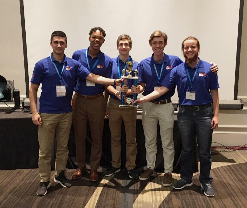 Five members of the Gator ITE student chapter posing with their trophy for winning the District Traffic Bowl