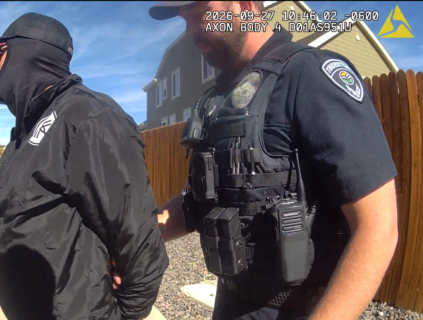 Body camera showing suspect in handcuffs