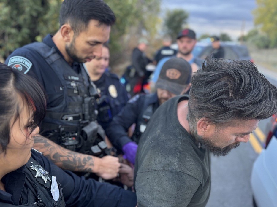 Suspect being taken into custody by officers