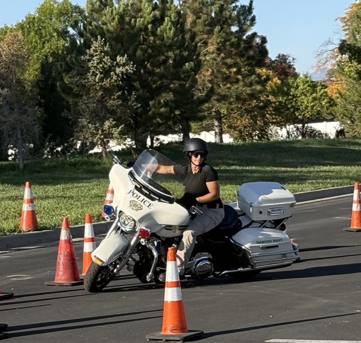 Officer Williams riding a motorcycle