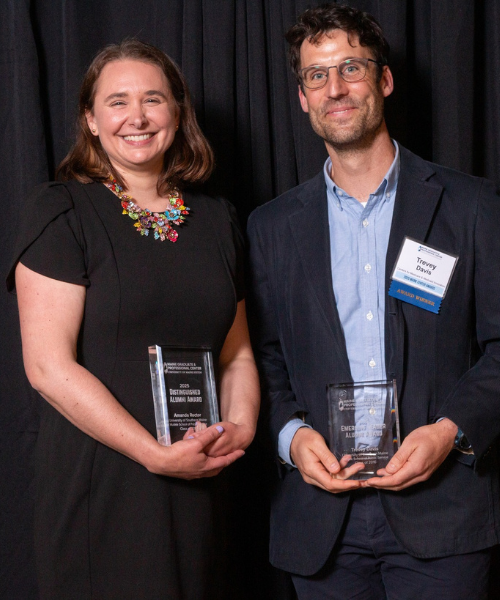 Amanda Rector and Trevey Davis at award ceremony holding their award
