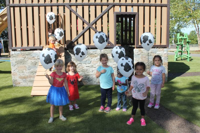 Kids with cow balloons