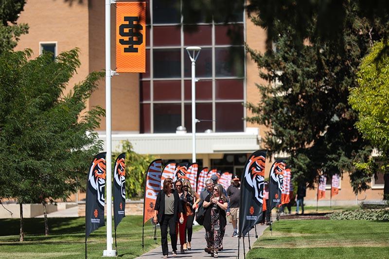 people walking on a college campus