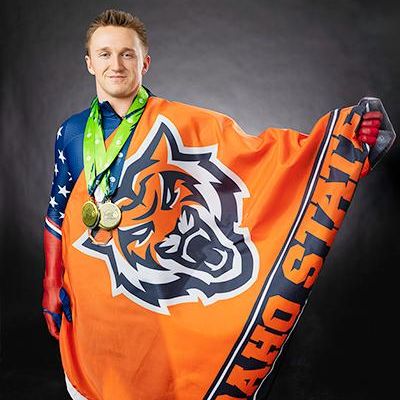 Olympic skeleton racer with Idaho State flag