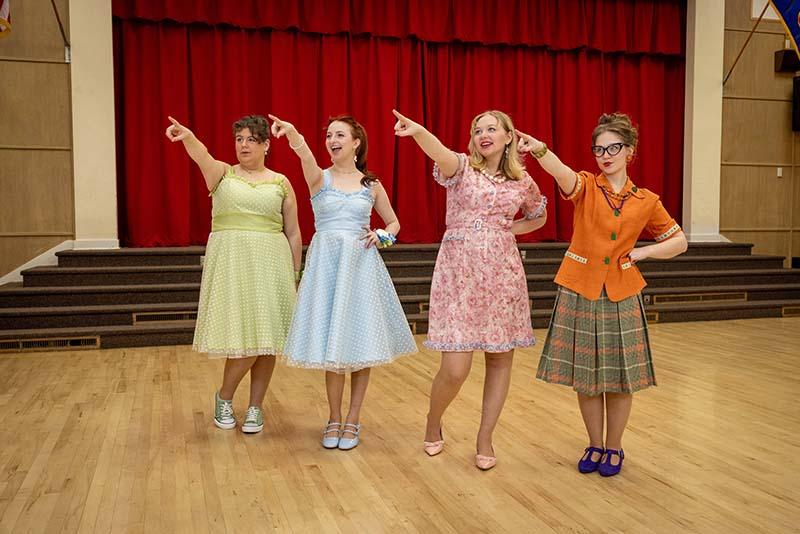 singers performing in a gym