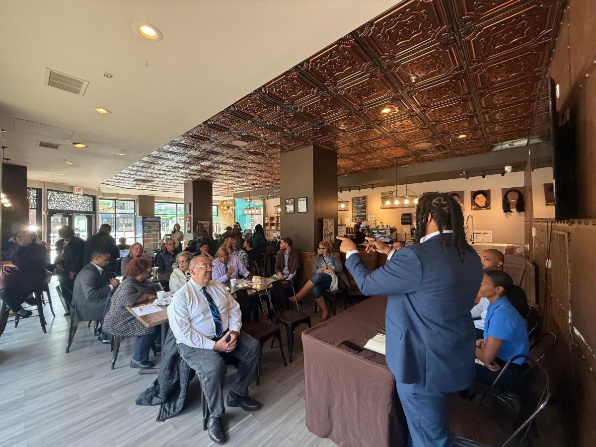 Attendees listening to a speaker at a roundtable