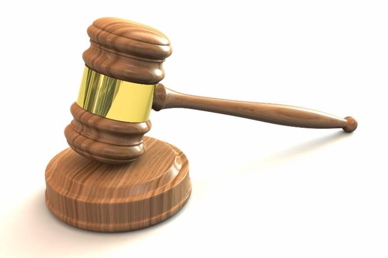 brown and gold gavel on white background