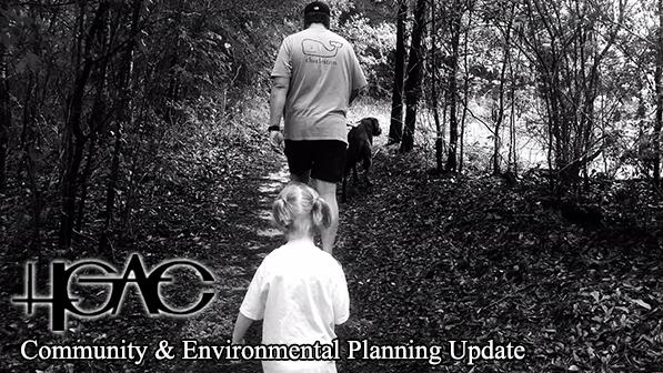 Child dog and man walking on a nature trail black and white photo