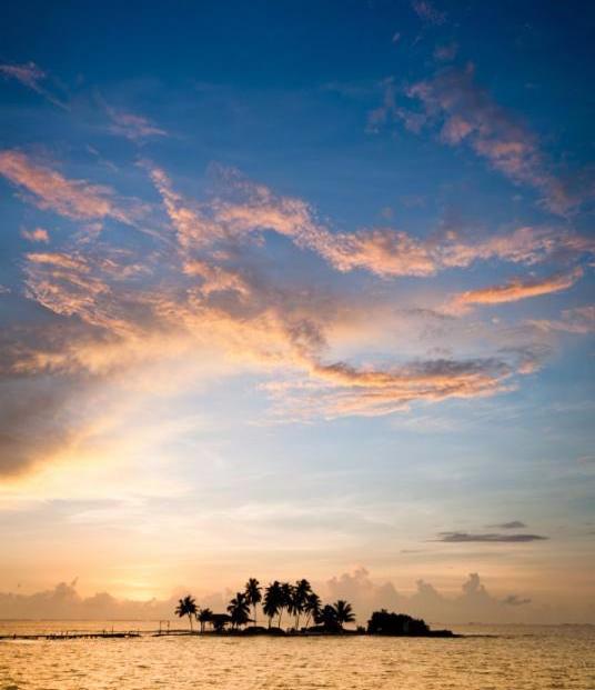Small tropical island at sunset in Belize