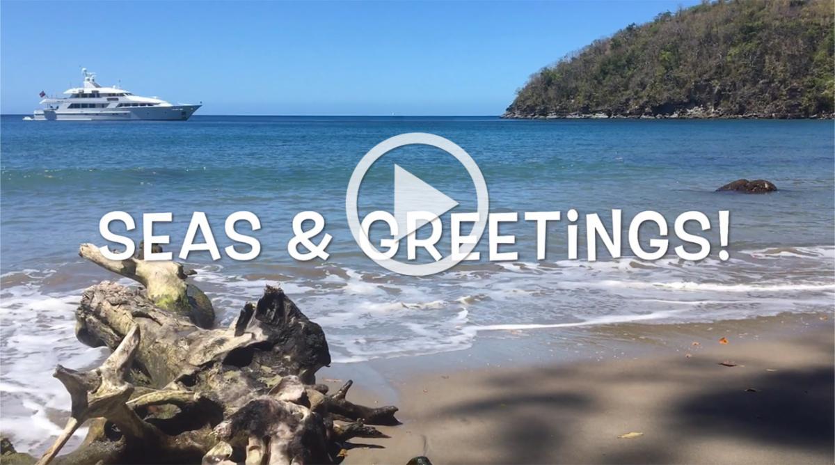 Seas & Greetings screenshot of yacht in BVI with play arrow