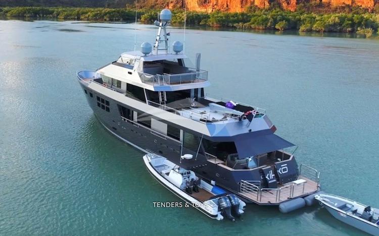 112ft AKIKO Alloy Yacht Motor Yacht pulling tenders behind it on the water.jpg