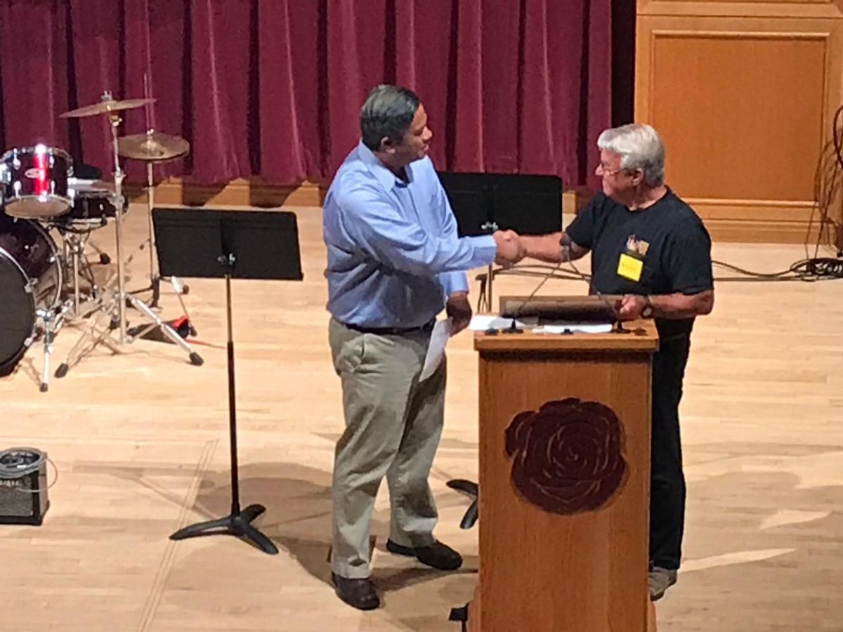 Nelson Garcia of Channel 9News receiving Appreciation Award from BMTL board co-chair David Necker