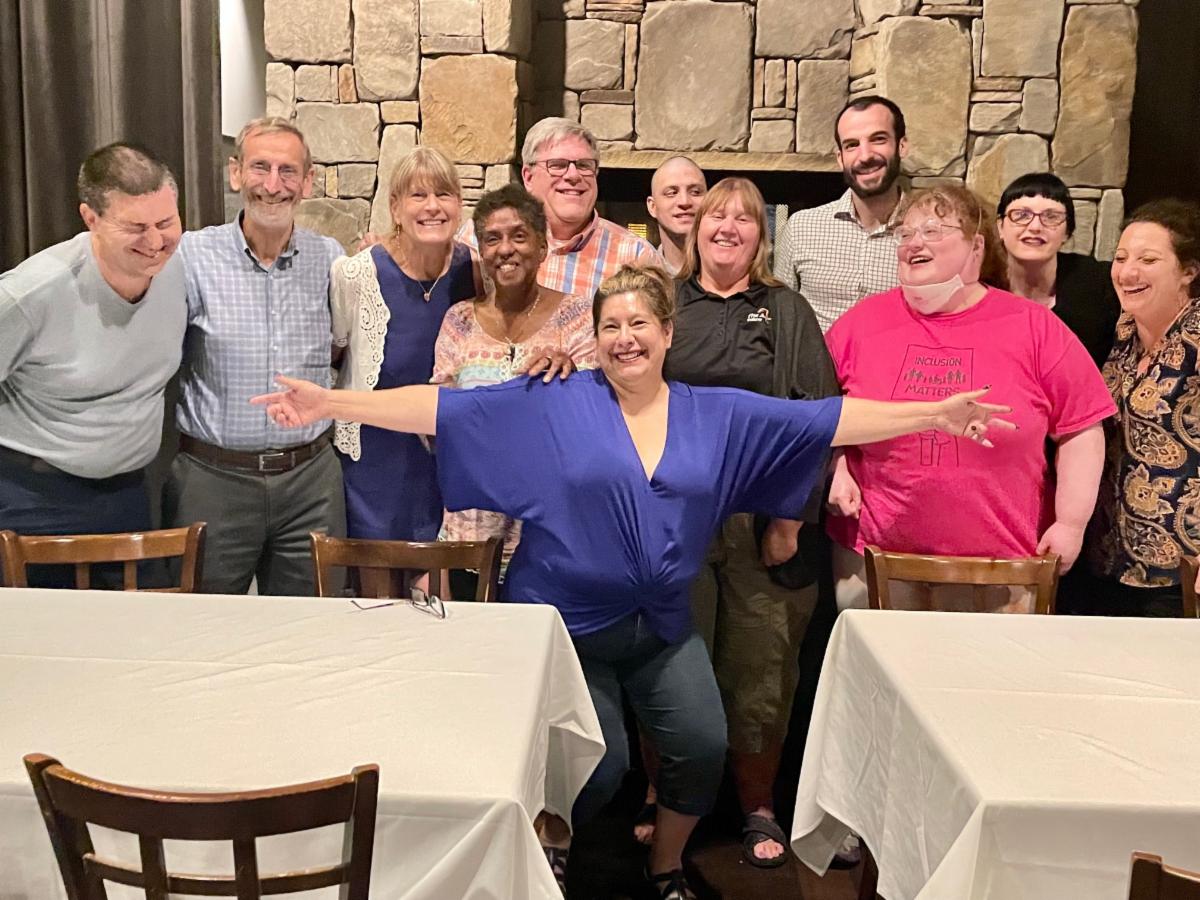 group of people posing together and smiling