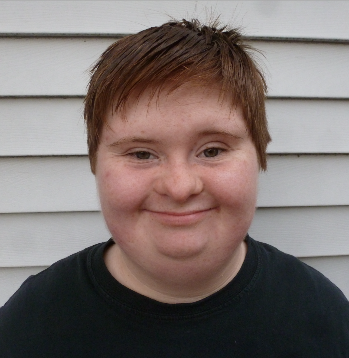 light skinned woman with short hair smiling