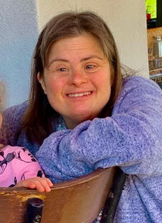 Cynthia Goldberg smiling in a purple shirt