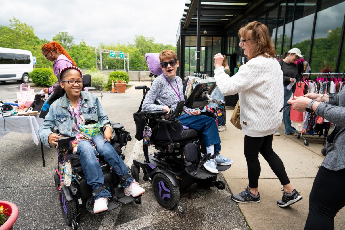 to wheelchair users getting ready to shop