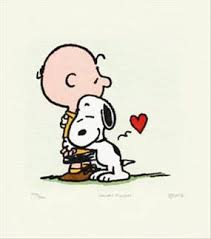 Snoopy giving Charlie Brown a hug 