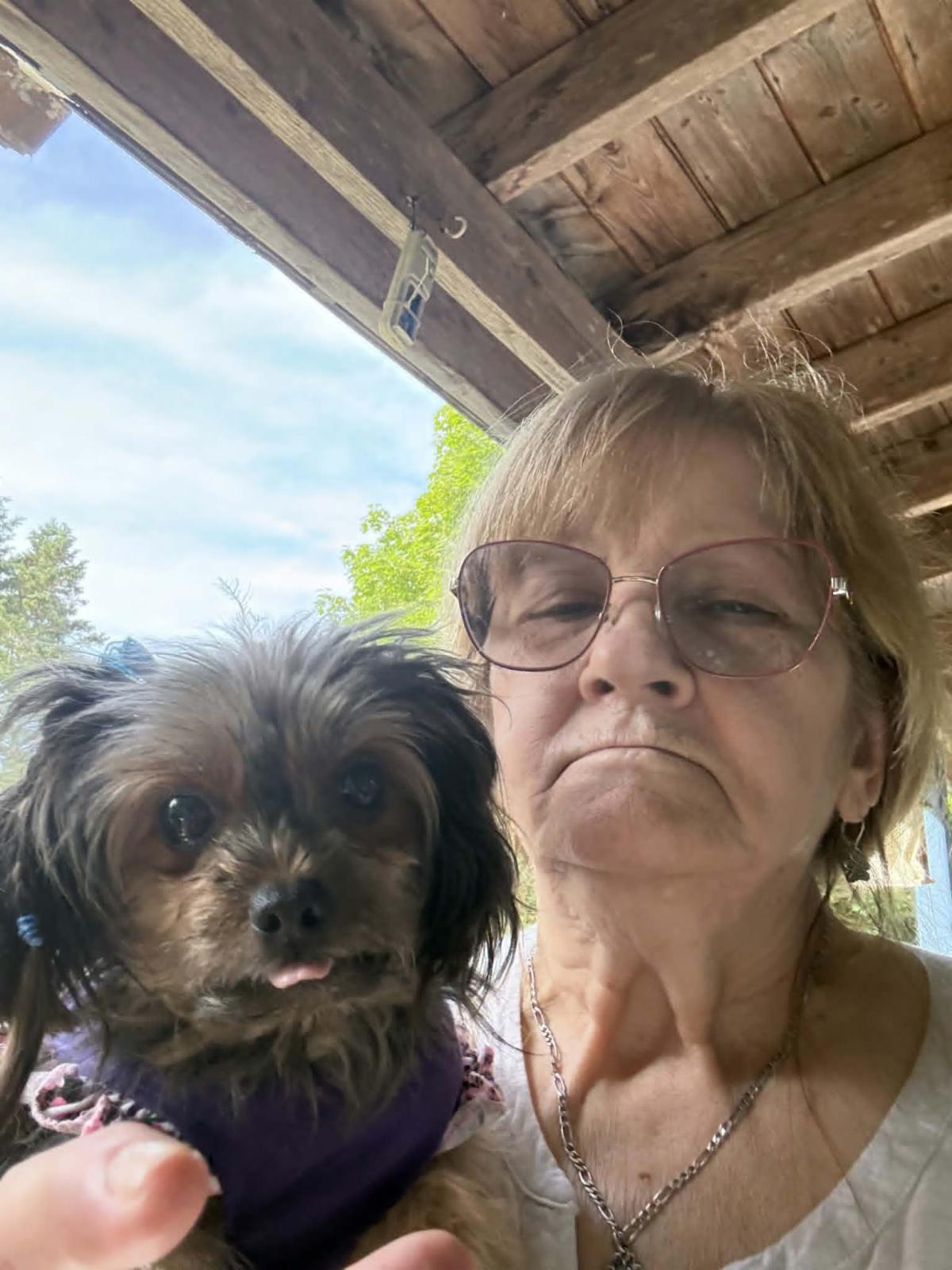 BTC winner woman holding a yorkie