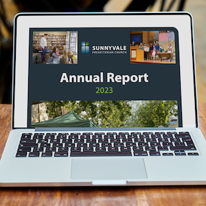 Photo of a laptop with the SVPC 2023 annual report on screen