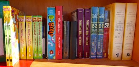 Different versions of the Bible on the Book Sale Cart