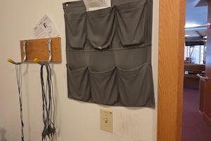 photo of the hearing assist devices hanging inside the ushers' closet